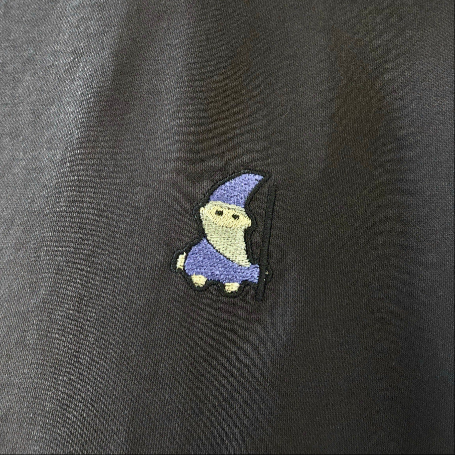 Embroidered wizard on black t-shirt