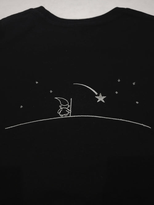 Black shirt with silver outline design of a Wizard looking into the nights sky